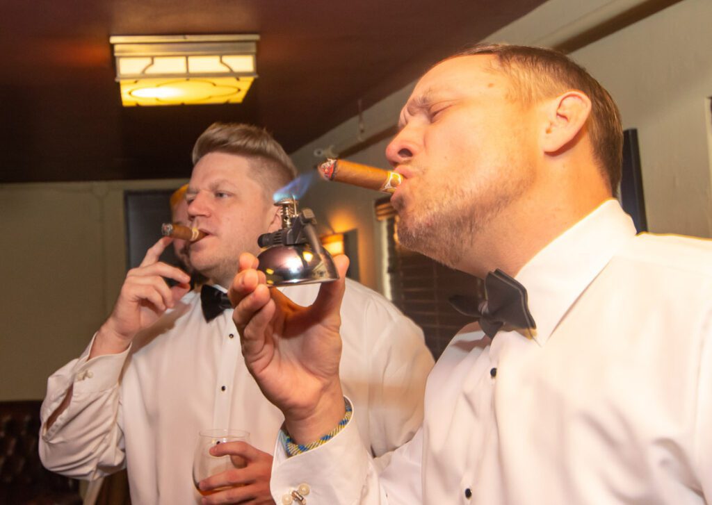 Michael and his groomsmen smoking with cigar