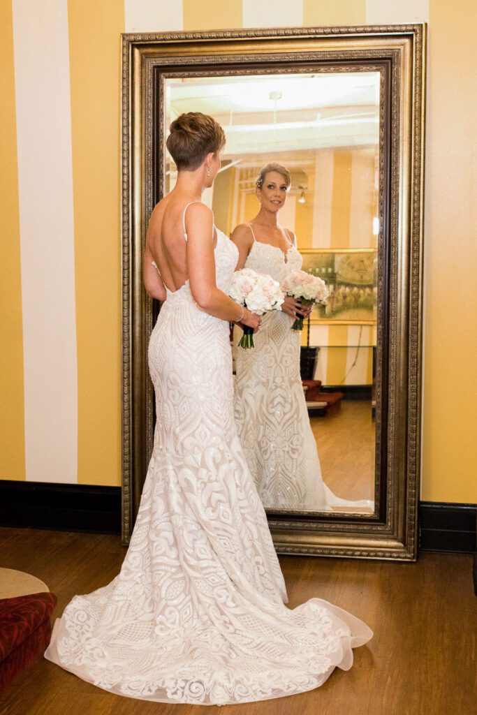 Laura looking at herself in the mirror