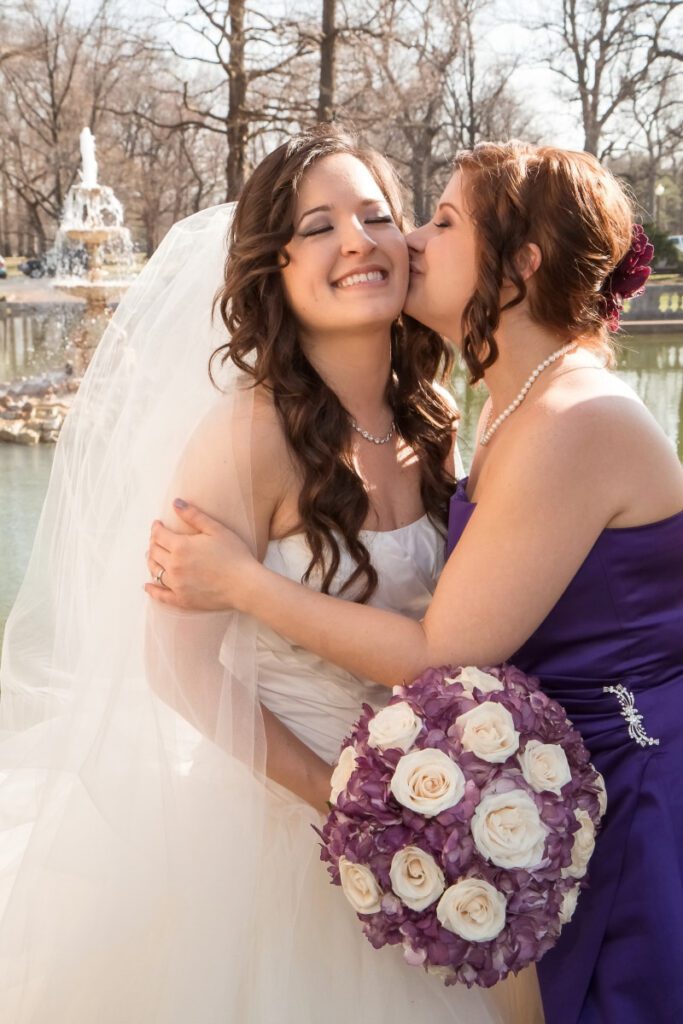 Sarah’s bridesmaid kissing her on the cheek