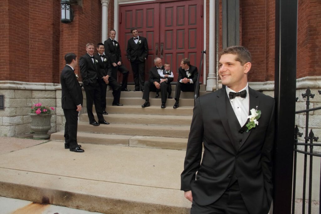 Jason with his groomsmen outside a building