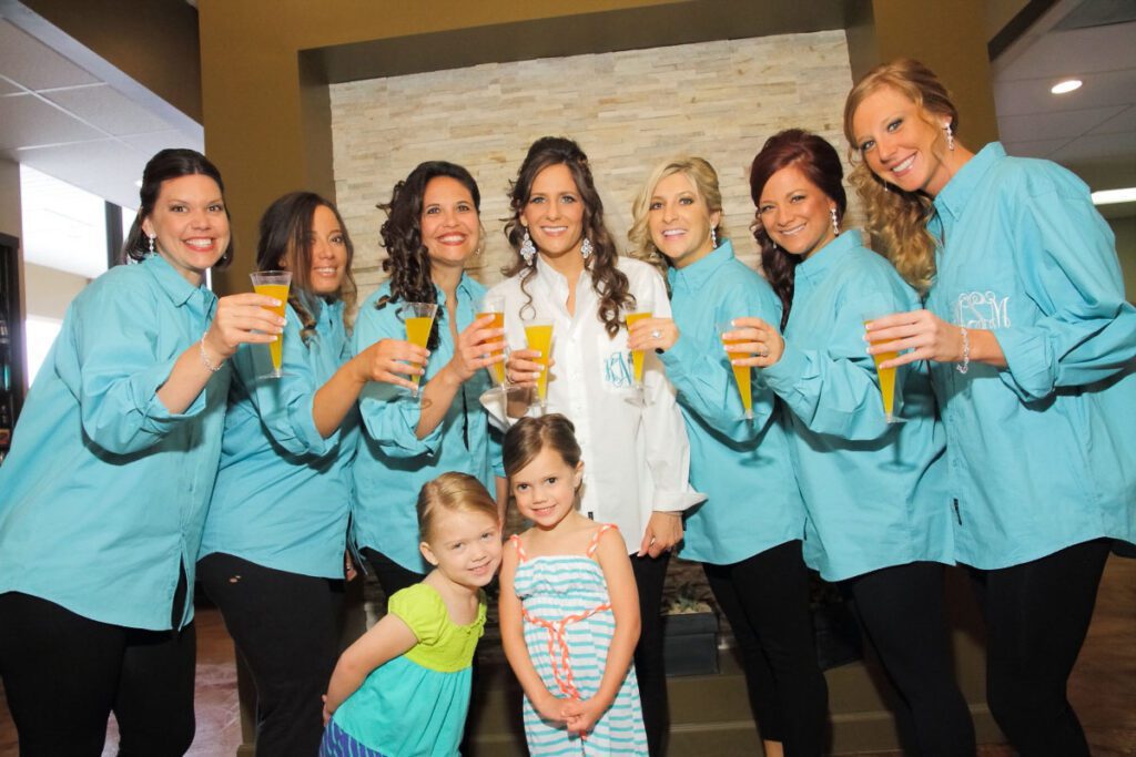 Kiley with her bridesmaids raising their glasses