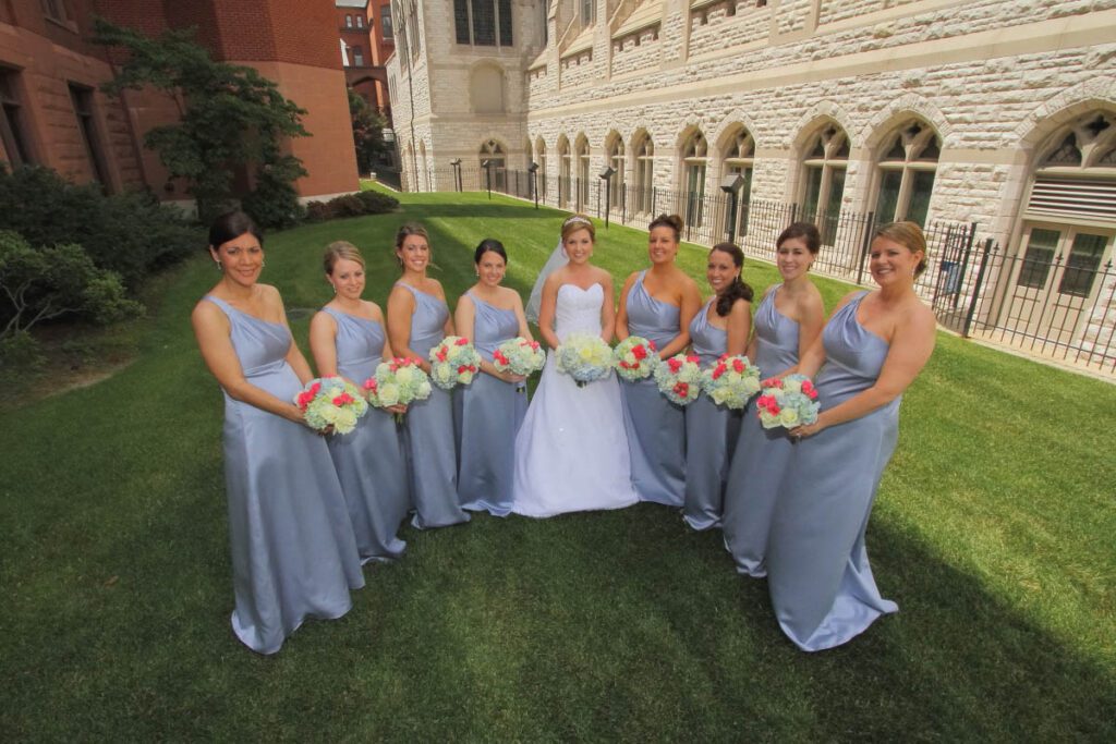 Sarah and her bridesmaids holding their assorted flowers