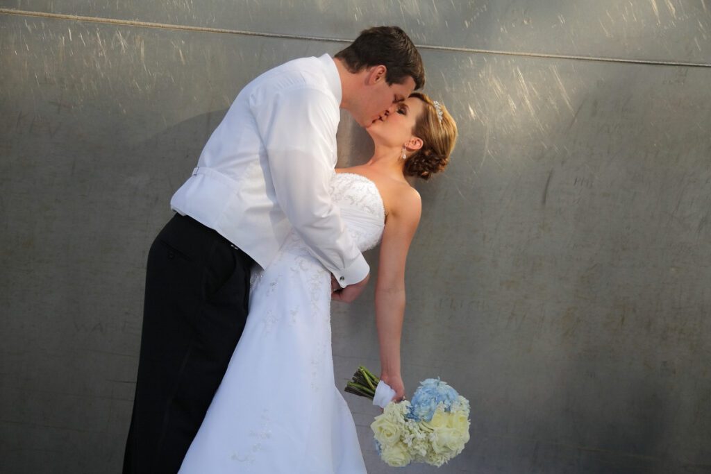 Sarah and Kurt share a kiss at the Gateway Arch base