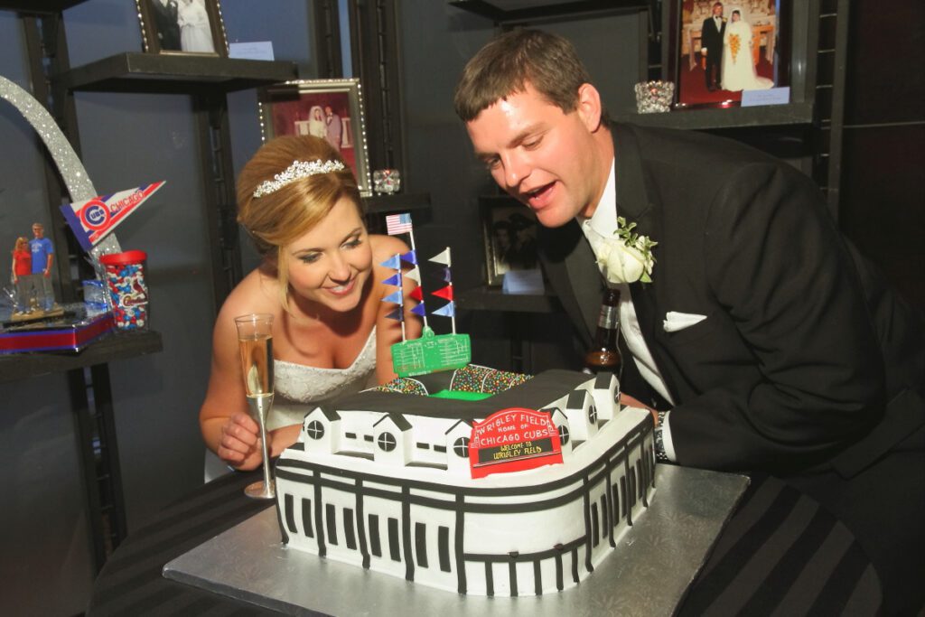 Sarah and Kurt looking at a custom cake