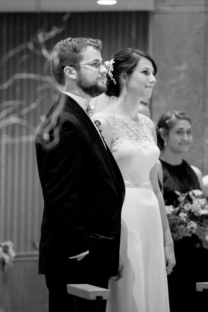 Casey and Joseph stand before the altar