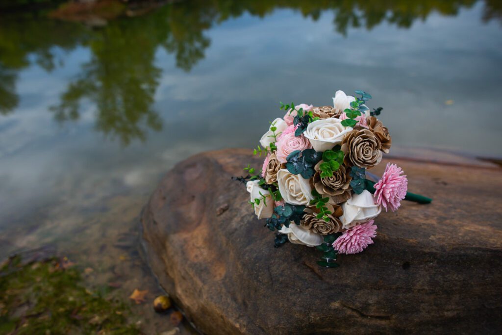 A flower bouquet on a rock