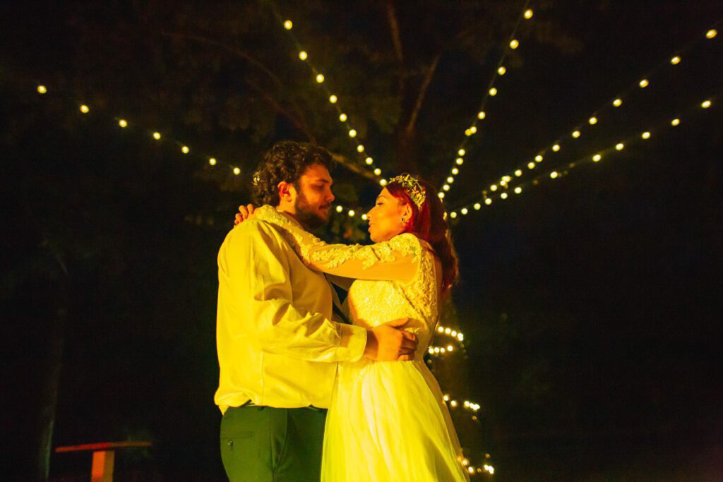 Nicole and Christian dancing with a yellow glow