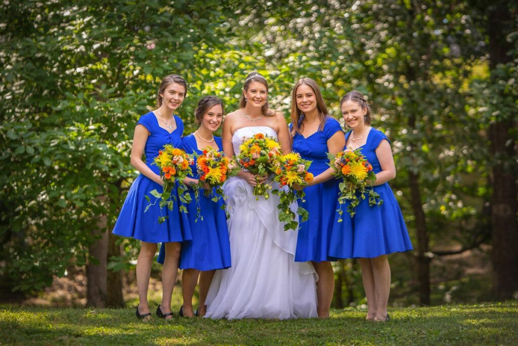 Sarah and her bridesmaids holding their flowers