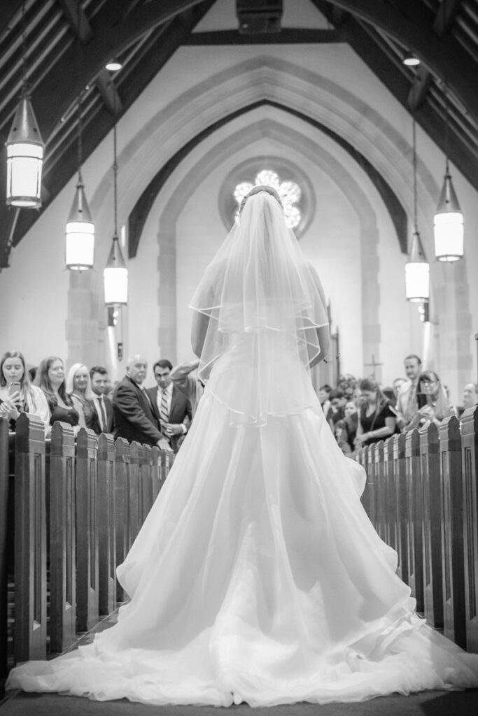 A grayscaled image of Sarah on the aisle