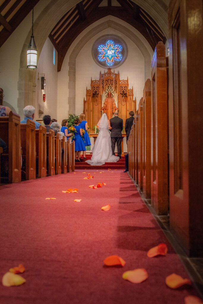 Flower petals on the carpet leading to the altar
