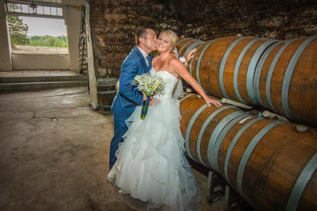 Lindsey and kiss beside barrels