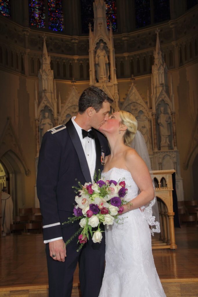 Elizabeth and Ryan kiss near the altar