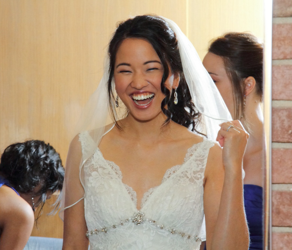 Alice laughing in her wedding dress
