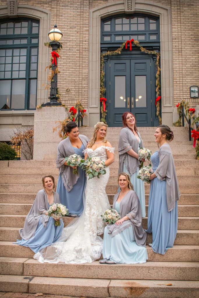 Rachel and her bridesmaids interacting on the stairs