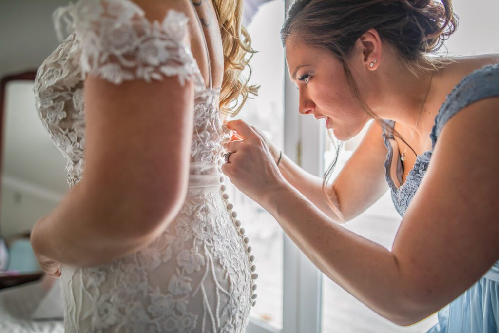 Rachel putting up her wedding dress