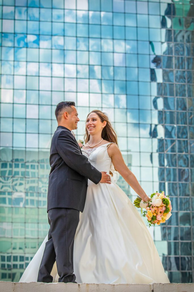 Amanda and Joe with a glass building background