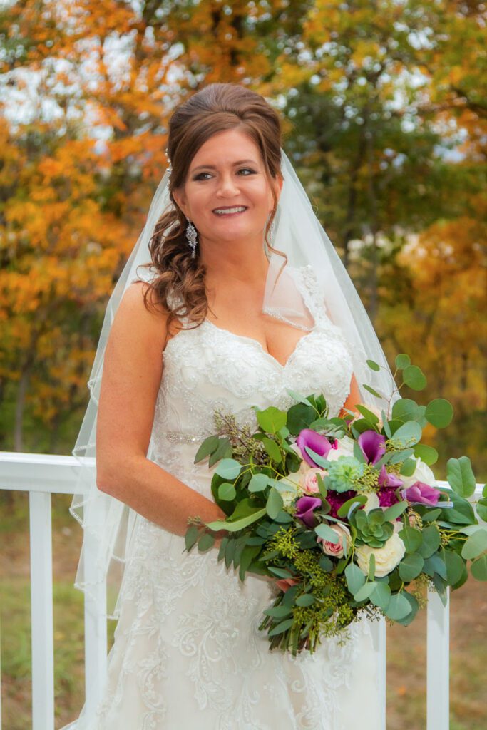 Nicole smiling in her wedding dress