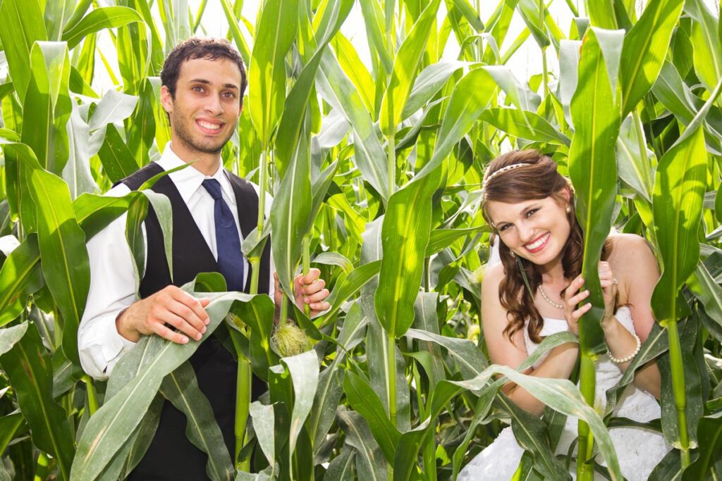 A bride and groom in corn plants