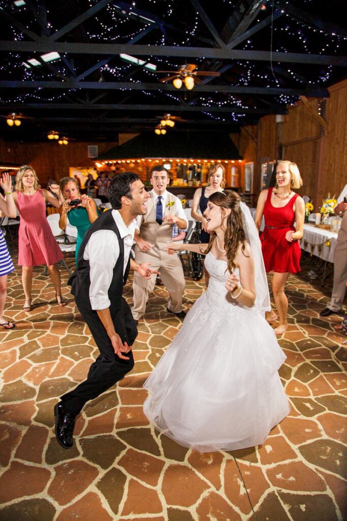 A bride and groom dancing in their party