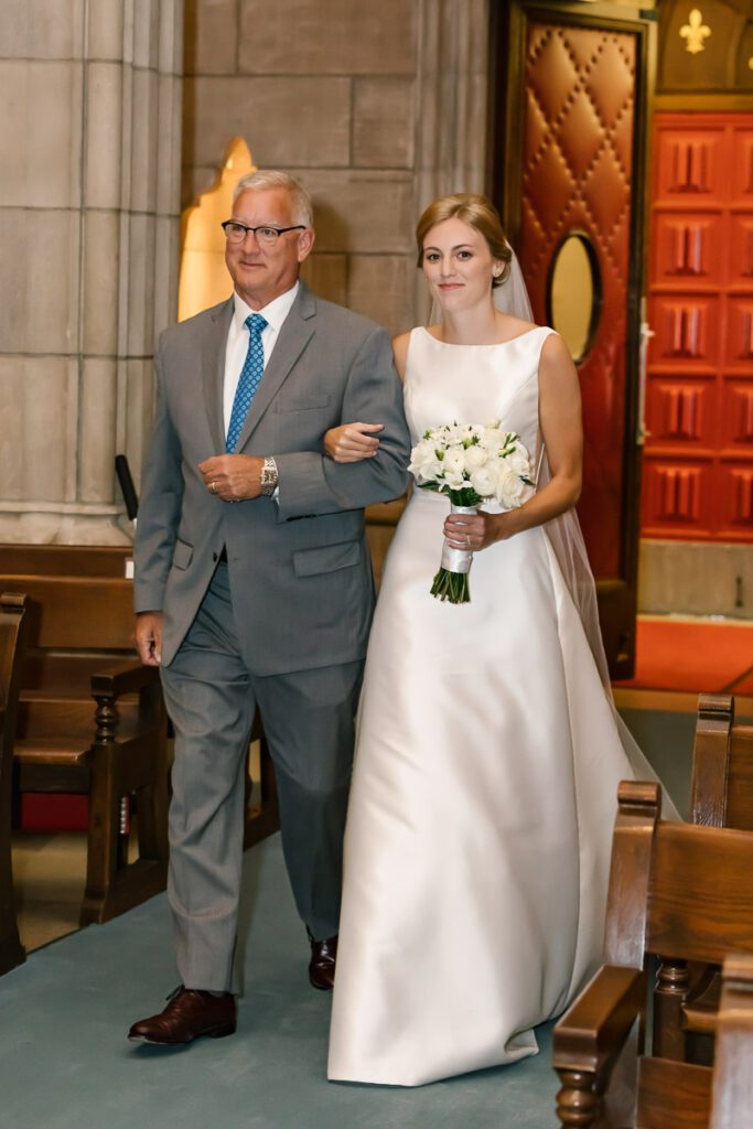 Laura walking to the altar with her father