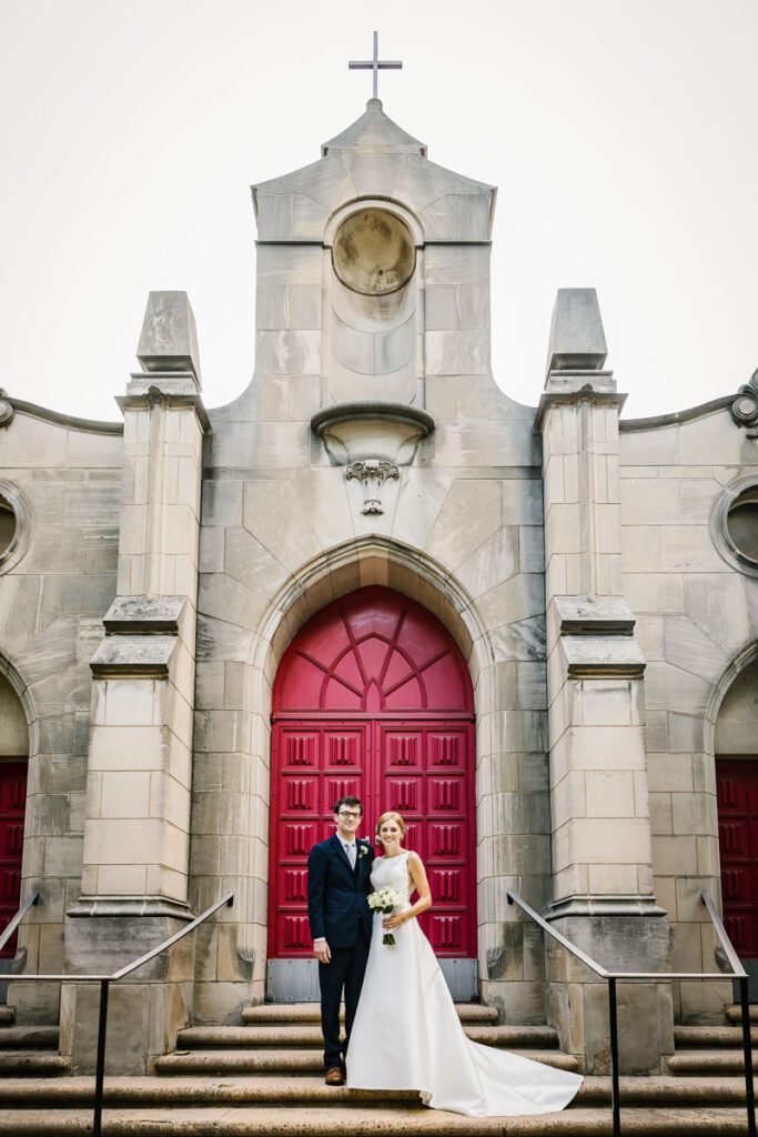 Laura and John at the entrance of the church