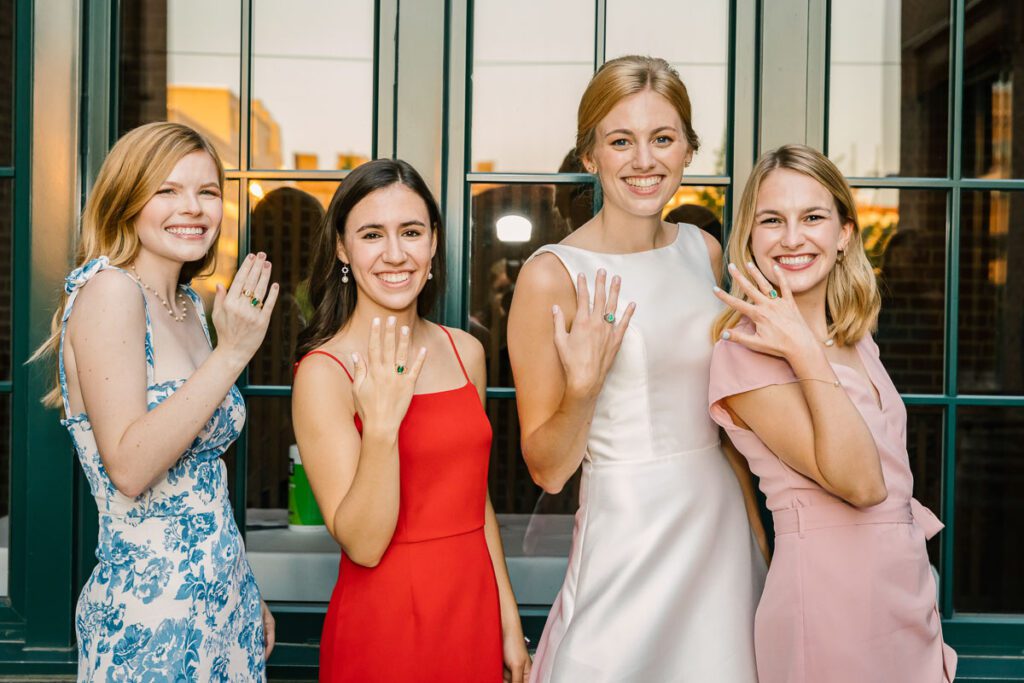 Laura and her friends wearing identical rings