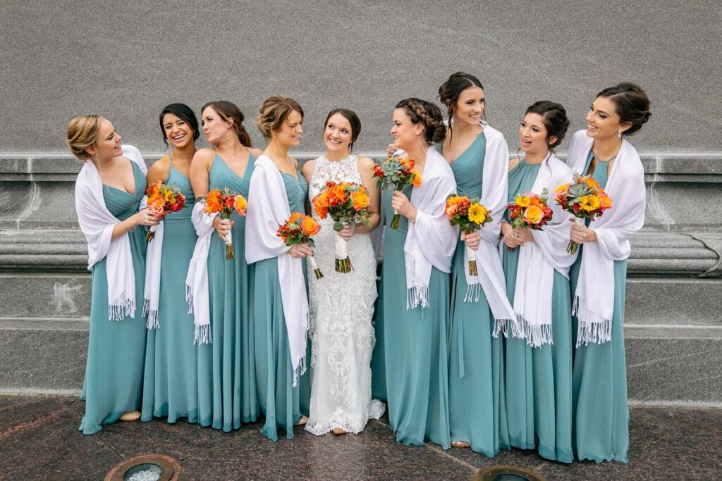 A bride with her bridesmaids in light blue