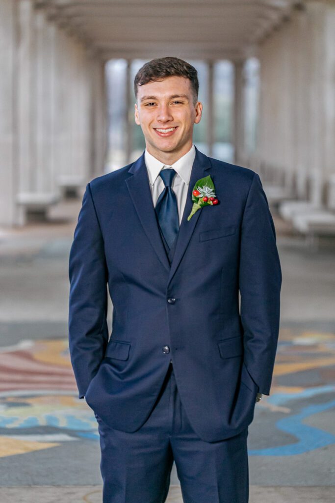 A groom in his blue wedding suit