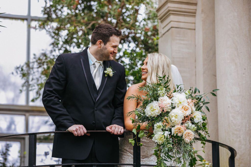 The bride and groom at a balcony of the garden