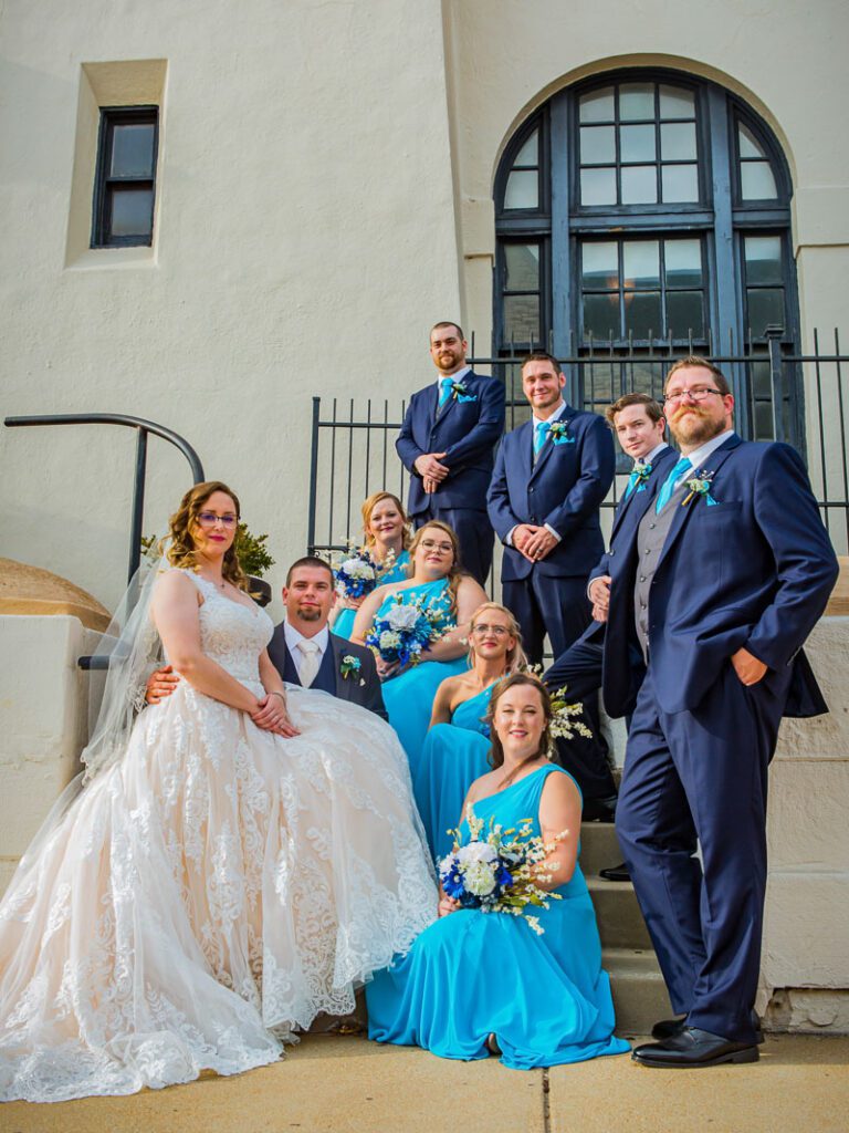 A larger image of Lacey and Tim beside their attendants