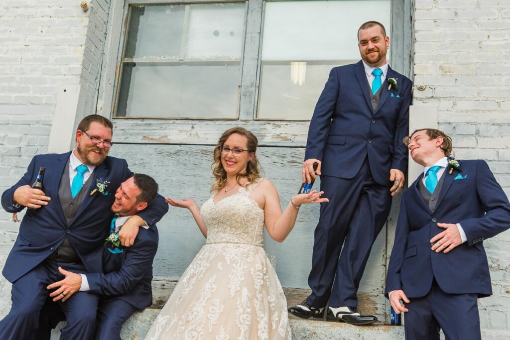 Lacey and Tim having fun with the groomsmen