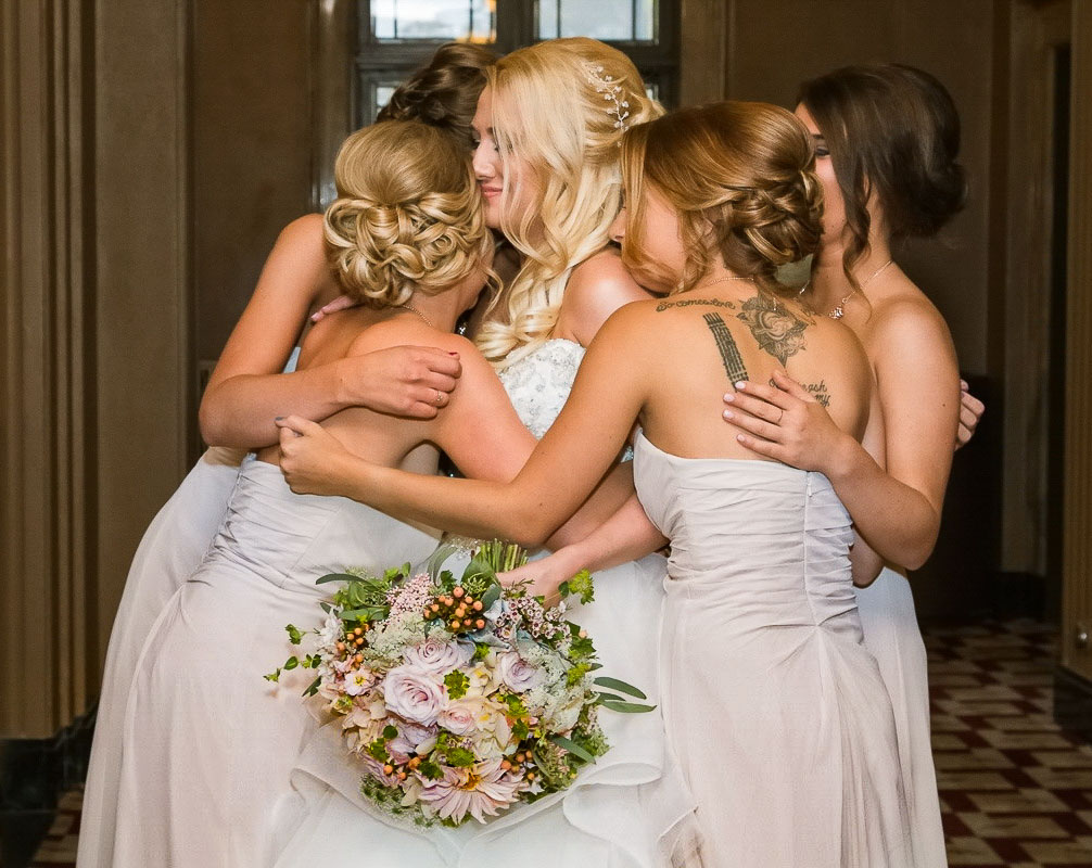 Danica hugged by her bridesmaids