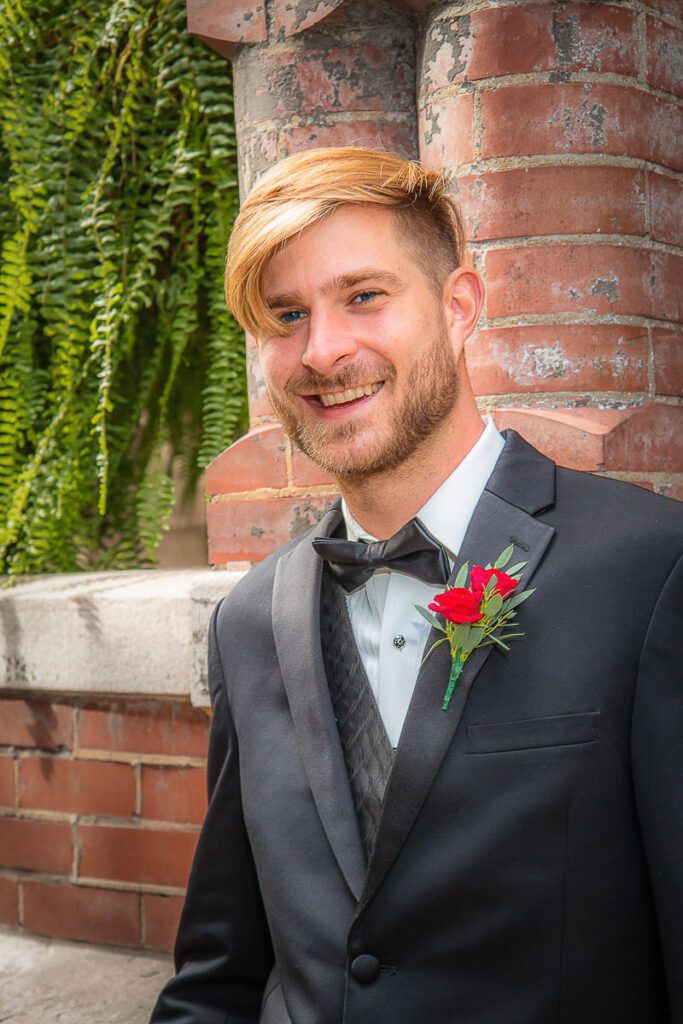 Shaun smiling in his wedding suit