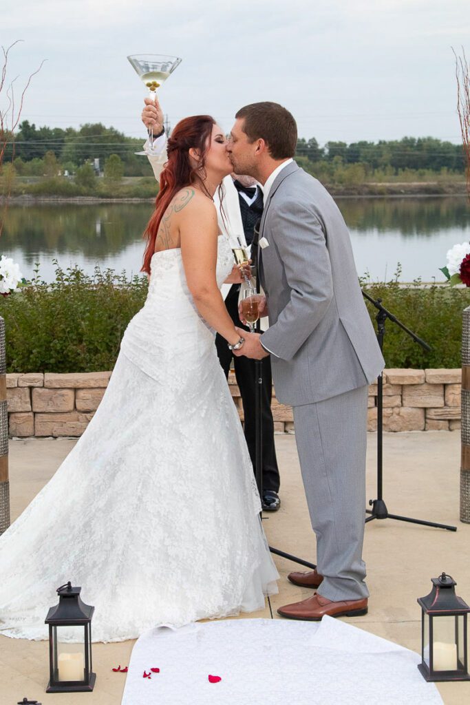 Brian and Jessica kissing at the altar