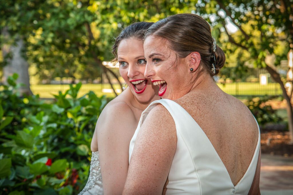 Two brides making happy faces