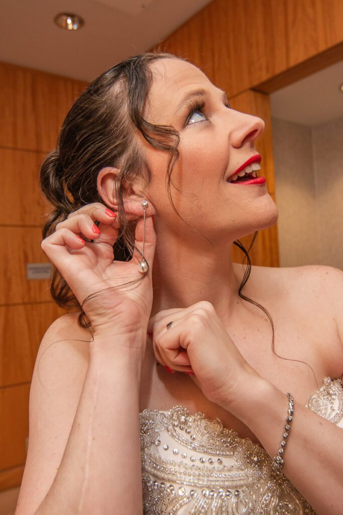 A bride showing her pearly earring