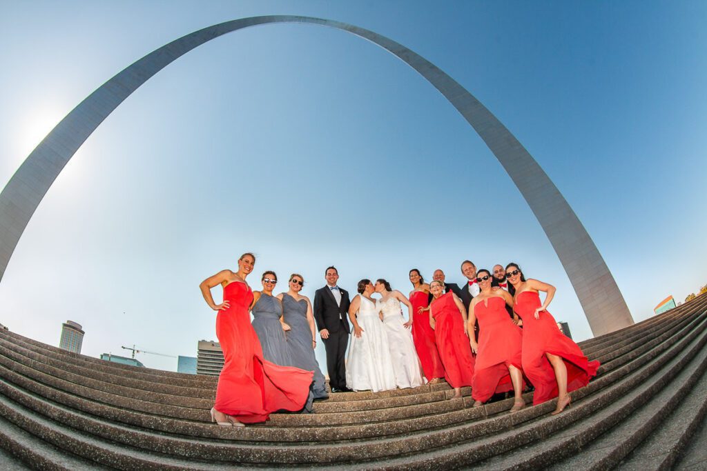 The brides and their attendants under the Gateway Arch