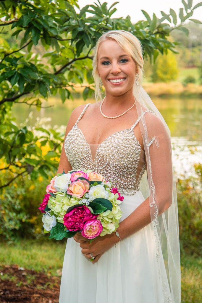 Kelley standing happily in her wedding dress