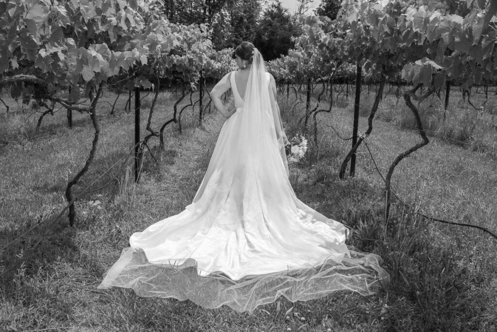 A grayscaled image of Kristen in a plantation