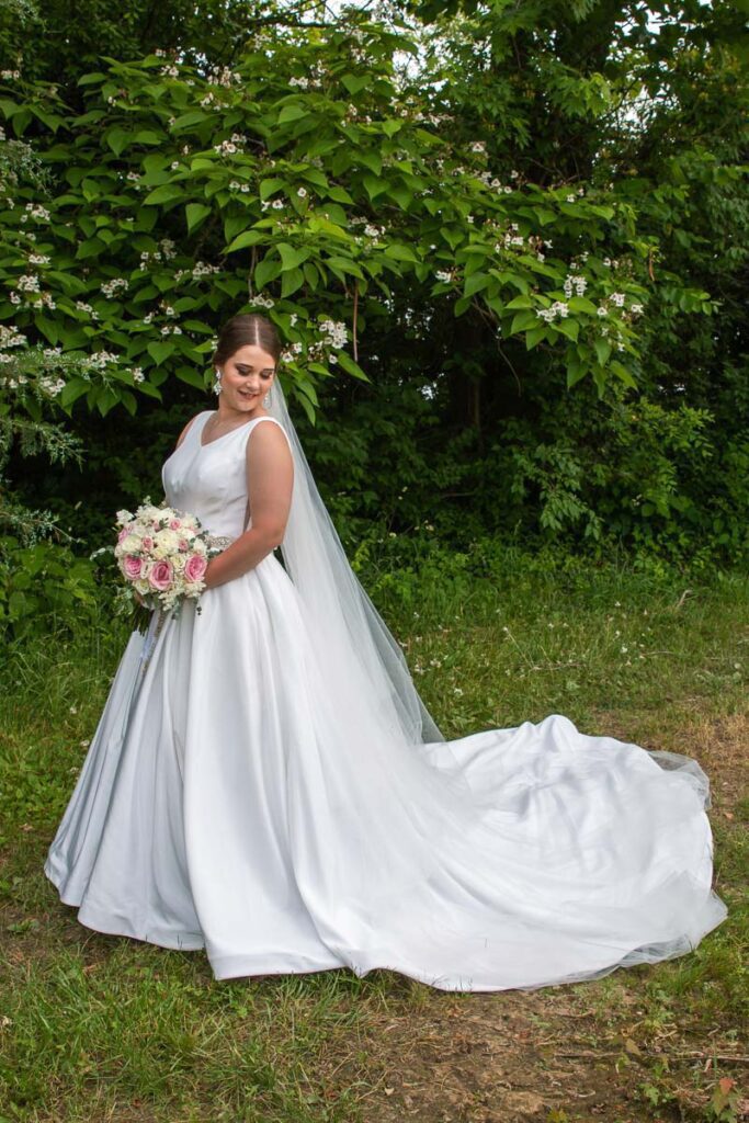 Kristen looking at her wedding gown