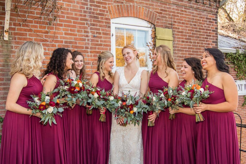 A bride with happy with her bridesmaids