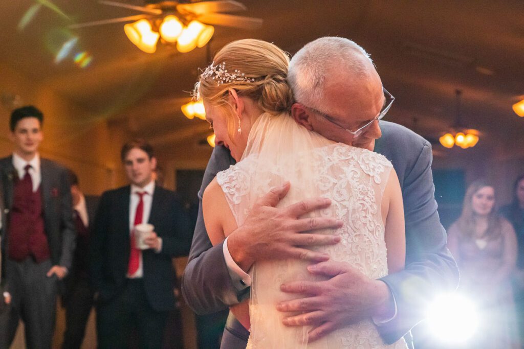 The bride hugging her father
