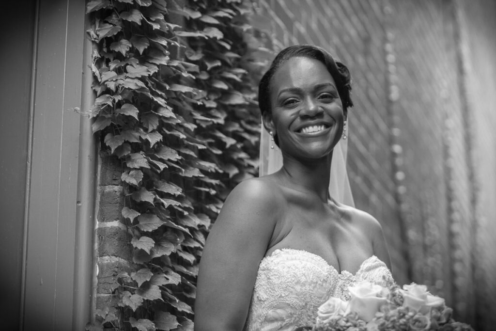 A grayscale image of Michelle smiling widely