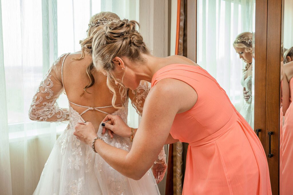 Erica finishing her wedding dress preparations