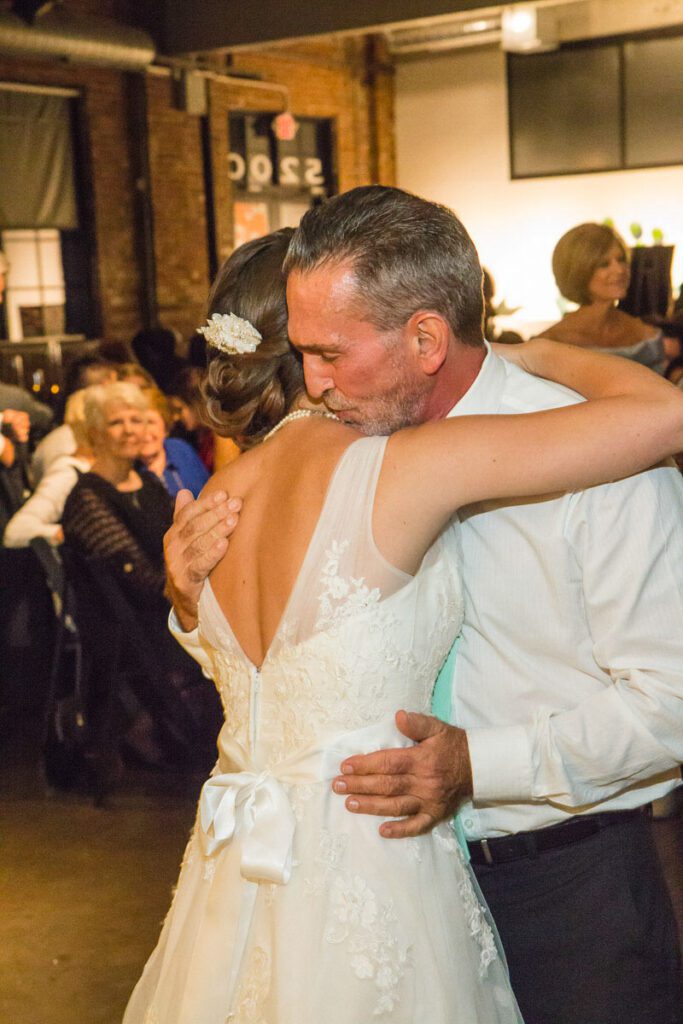 A bride dancing with her father
