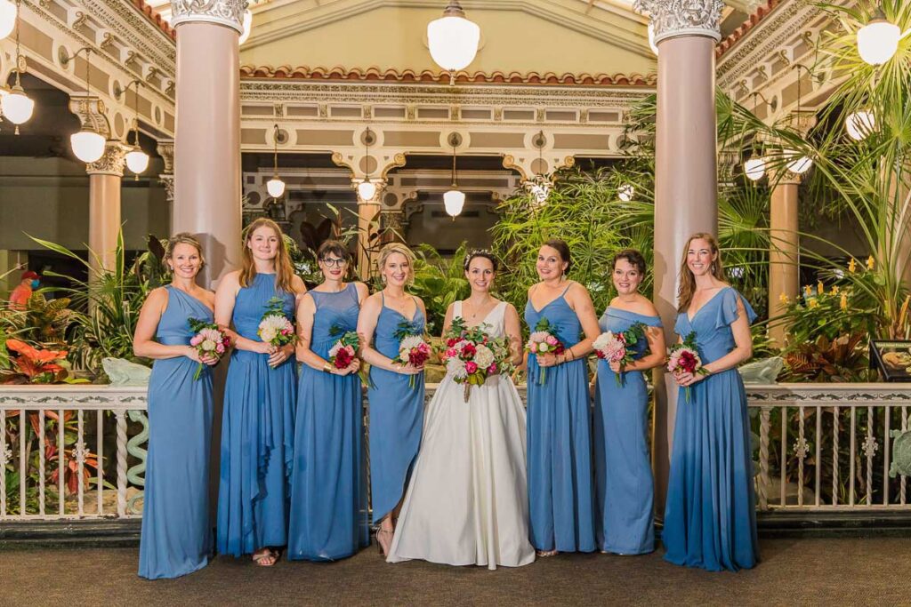 Claire and her bridesmaids holding flowers
