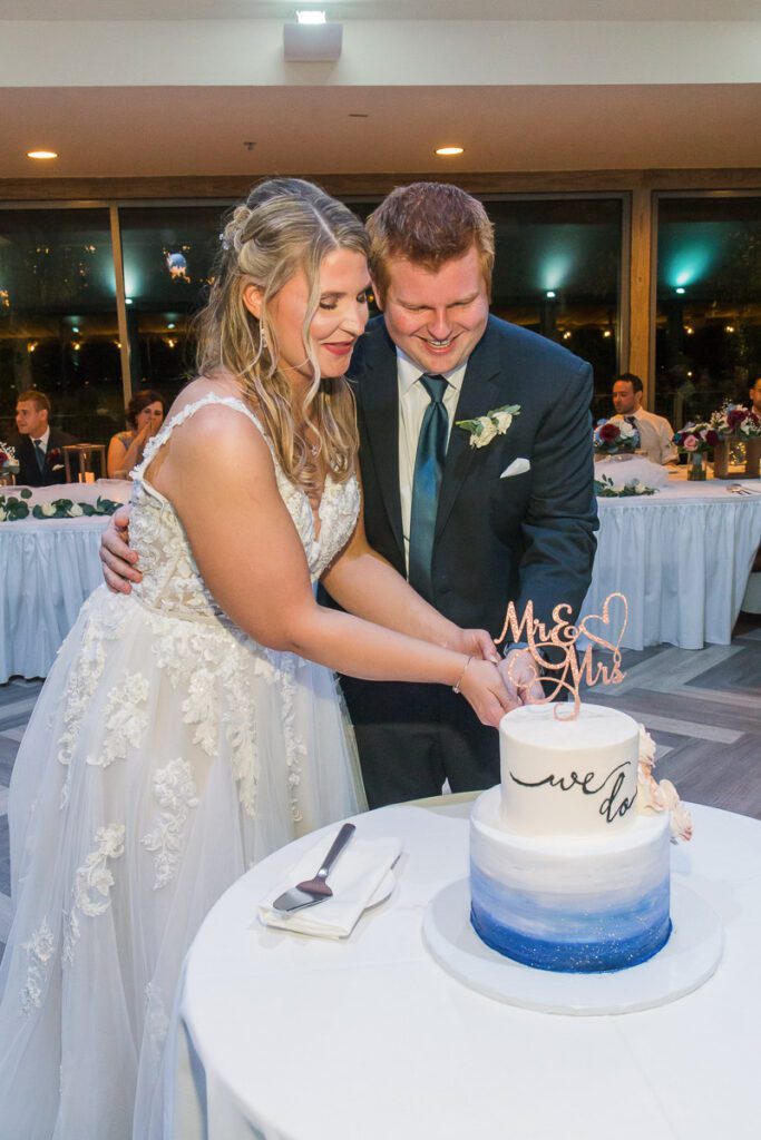Brian and Justine slicing the cake