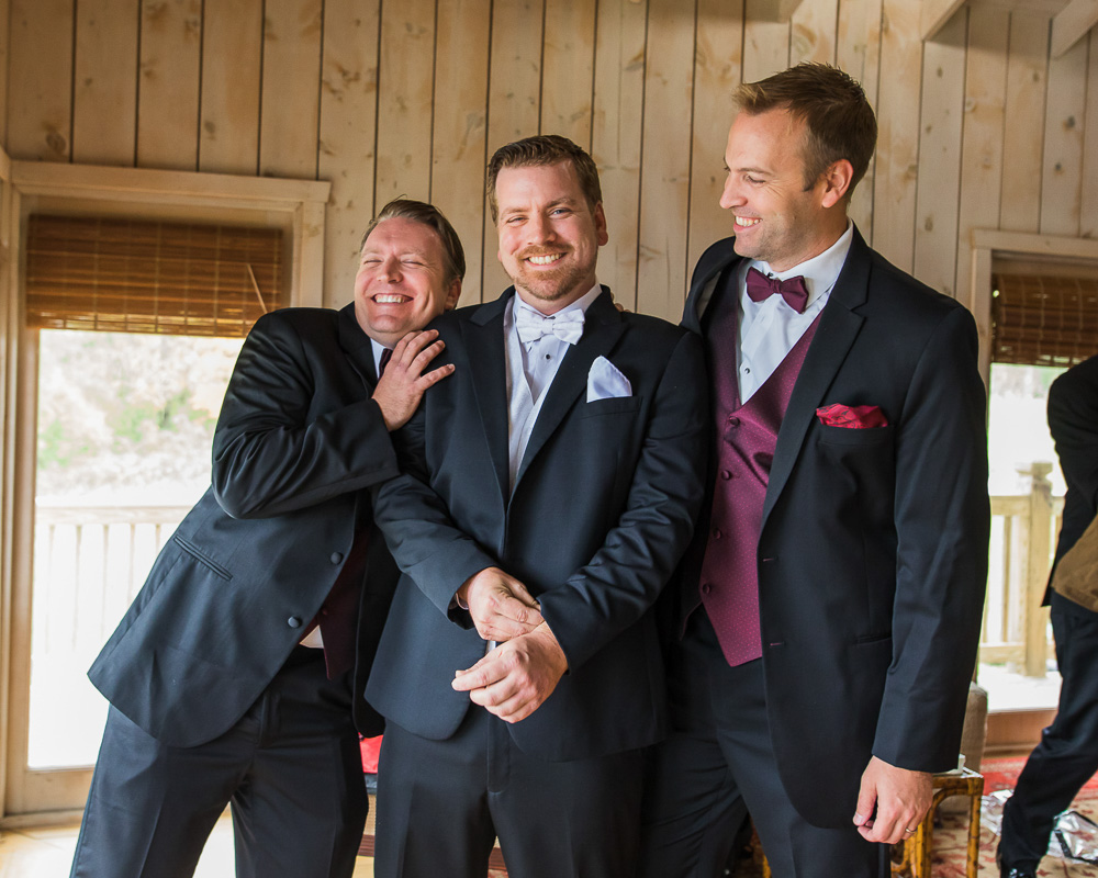 Anthony laughing with his groomsmen