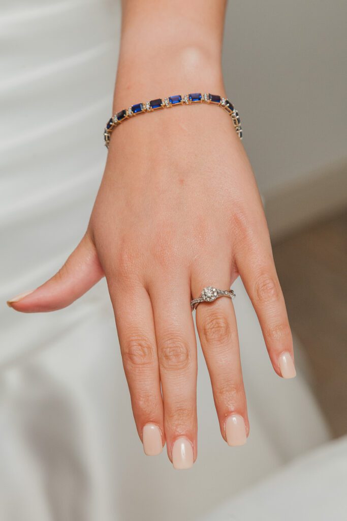 Rachel wearing a ring and bracelet