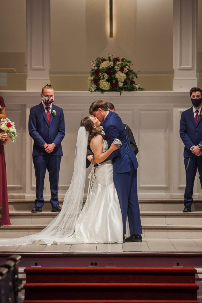 Rachel and Jonathan kiss at the altar